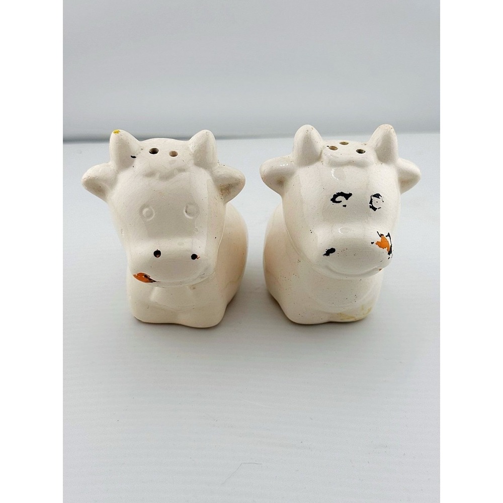 Vintage 1970's porcelain cow salt & pepper shakers. Some flaws see photos.